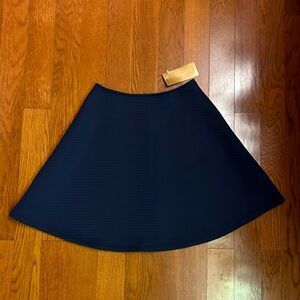 Brand new with tags. Navy blue skater style midi skirt with a high waist. Small